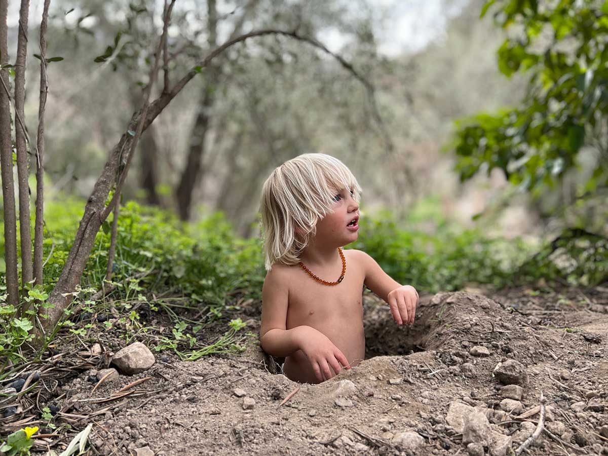 Our little foreman Lue, making sure the footings are deep enough